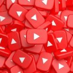 a lot of small red youtube play button blocks piled up together